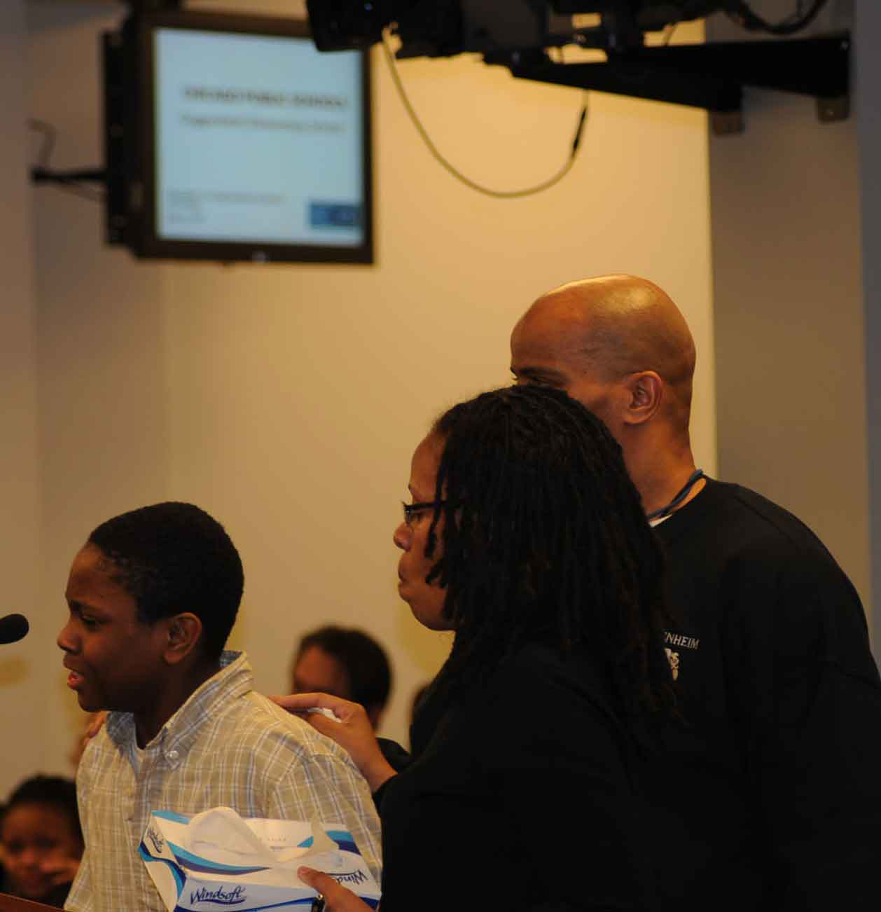 When one of the students who testified against the closing of Guggenheim Elmentary School broke down in tears during the January 29, 2010 hearing, teachers Jacqueline Jones and Earnest Jones brought tissues and comfort to him. Substance photo by George N. Schmidt.