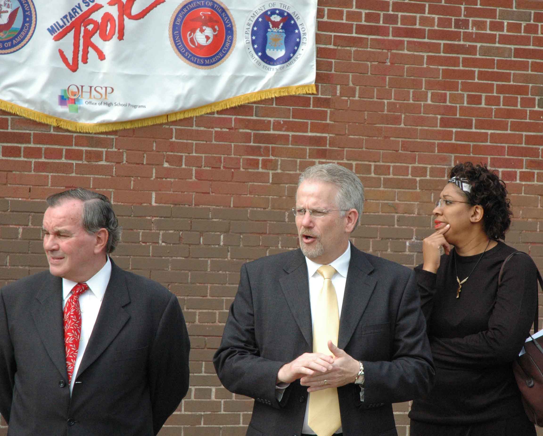 Retired Army Colonel Rick Mills (above, center) was part of the group that dedicated the 