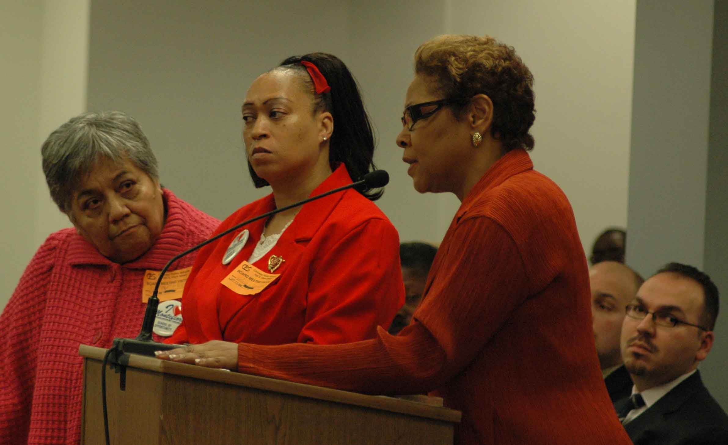 Above Right. At the Board’s March 26 meeting, Chicago Board of Education’s “Chief Special Services Officer” Renee Grant Mitchell explains to parents from Montefiore Special School that CPS does not intend to privatize the school’s services, despite evidence from more than four years of the closing and cutbacks in special services in CPS. At every instance where a special education program was rumored to be cut, Schools CEO Arne Duncan and Grant Mitchell assured parents and staff that the school would not be closed, and within a year the school was closed. the list of programs includes LeMoyne, Spalding, and others. Substance photo by George N. Schmidt. 