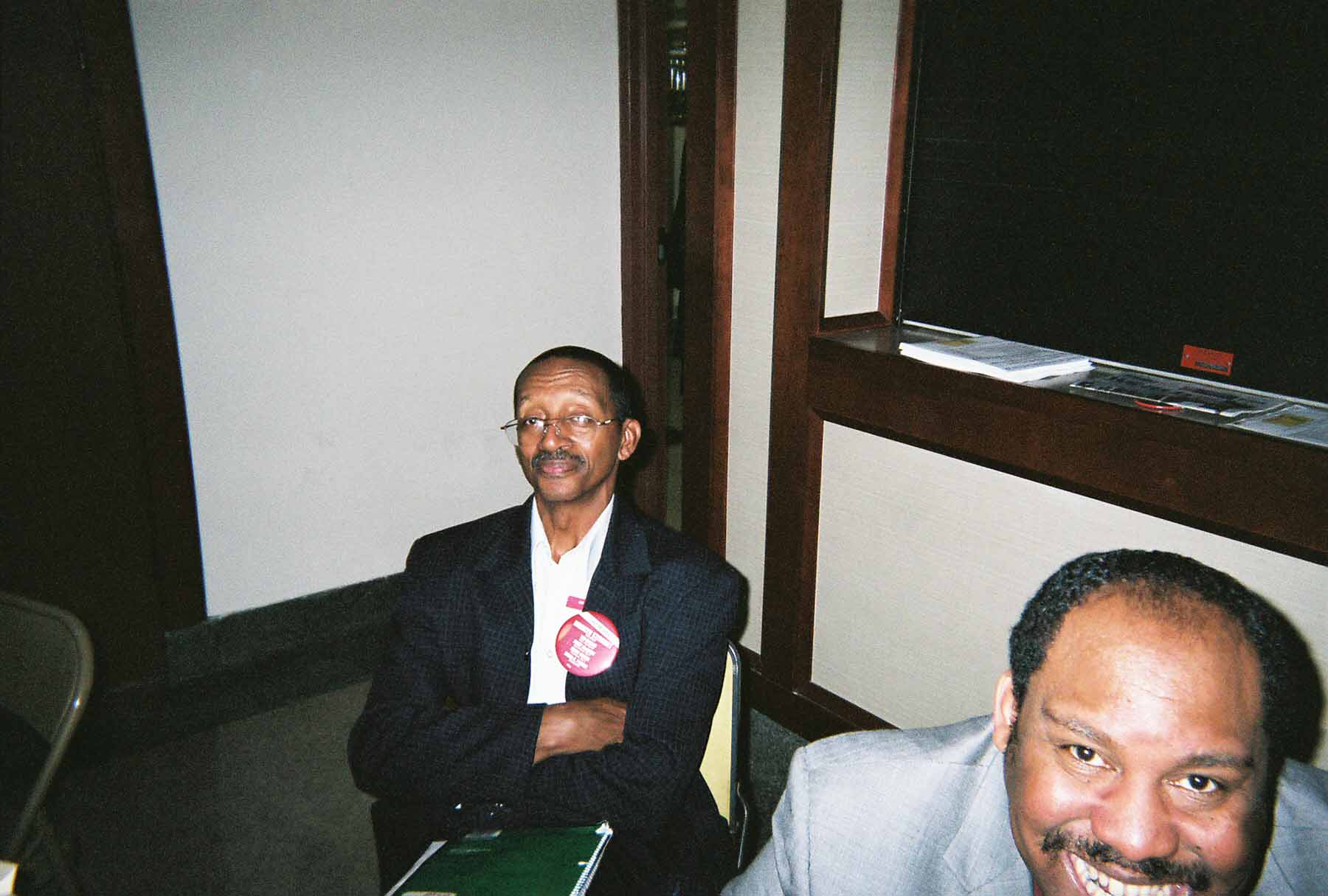 At the May 2007 meeting of the Chicago Teachers Union’s House of Delegates, more than 100 members of the union’s part-time and full-time staff were sitting at credentials tables sporting huge UPC election buttons like the one above. One year later, Stewart’s UPC — posing as the leadership of the Chicago Teachers Union — has accused CTU Vice President Ted Dallas of using the union for partisan political activity — something Stewart encouraged exactly one year earlier when the CTU election was still looming. At the sign-in tables for the May 2007 union meeting and around the union hall, Substance counted more than 100 union staff (including district supervisors, above) wearing partisan buttons supporting Stewart and her slate. Substance photograph by George N. Schmidt.