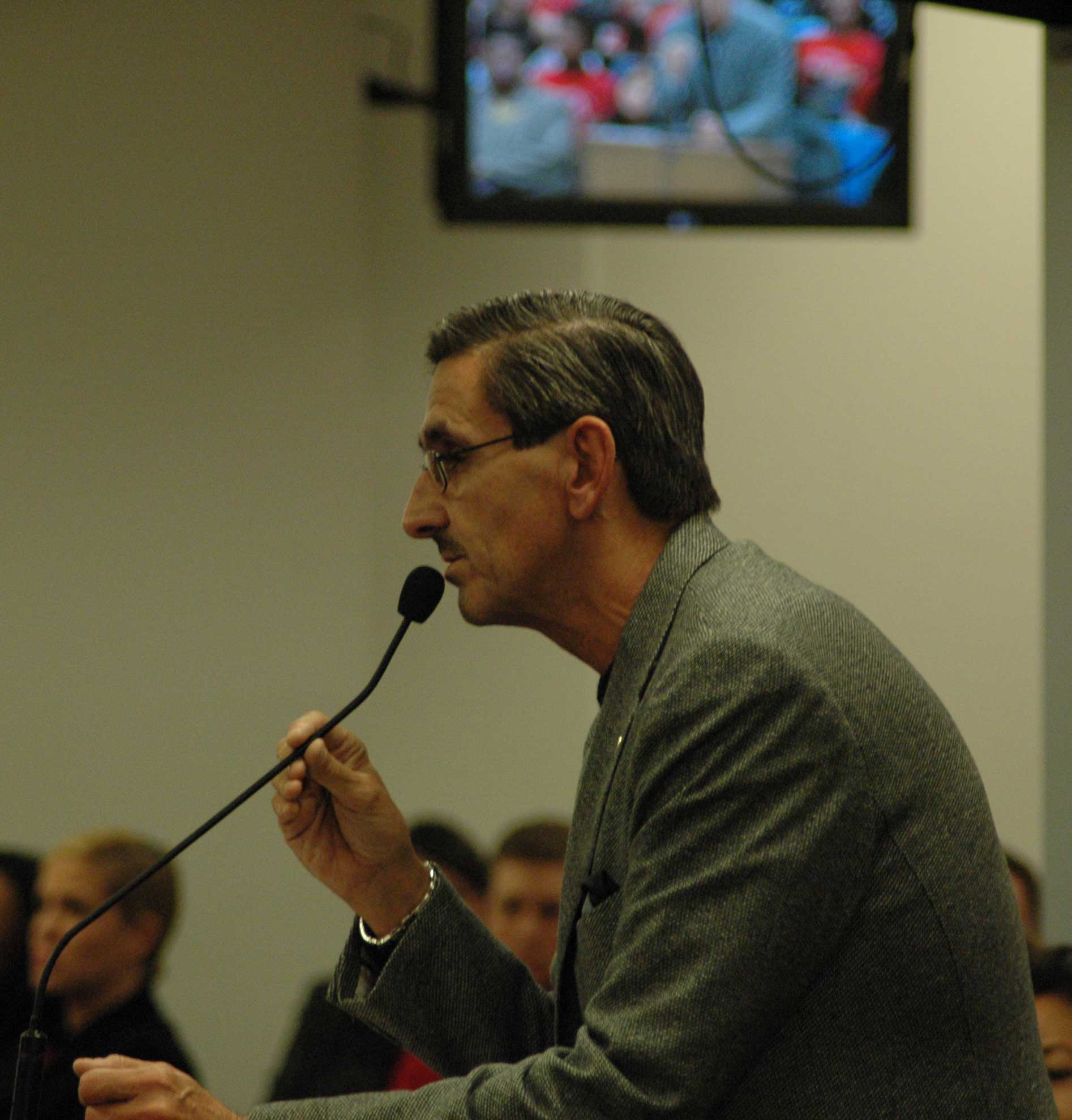 Chicago Teachers Union Vice President Ted Dallas spoke forcefully against the Chicago Board of Education's plans to close or reorganize 19 public schools (and end the careers of hundreds of union teachers) during the February hearings on the proposals. Above, Dallas spoke against the closing of Andersen Elementary School (which was changed into a 