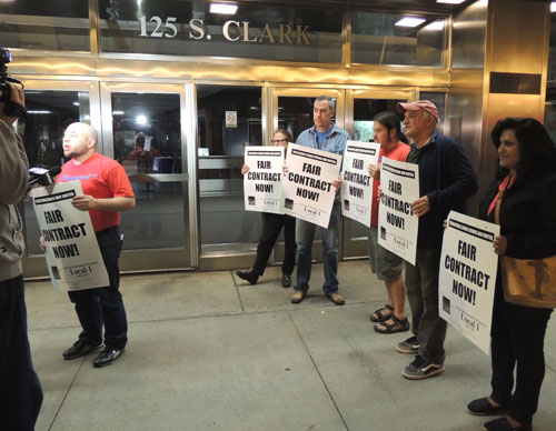 Six hours before the picket lines began forming at more than 600 real public schools across the third largest city in the USA, pickets began round-the-clock picketing at midnight at CPS headquarters in Chicago's Loop. Less than 24 hours after the above photograph was taken shortly after midnight on September 10, 2012 (the first day of the strike) tens of thousands of strikers and supporters were gathered at the same location for the first of the daily rallies that were a feature of the first Chicago Teachers Union strike in a quarter century. Substance photo by George N. Schmidt.