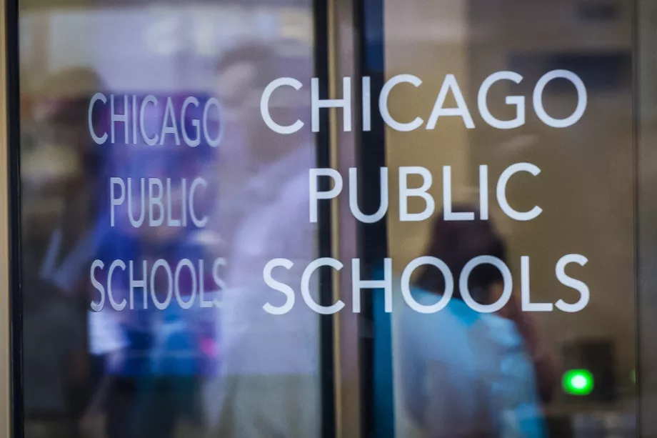 A key Chicago Public Schools official with close ties to the CEO has been charged with lying to the FBI about a controversial private custodial contract worth at least $1 billion, federal court records show.