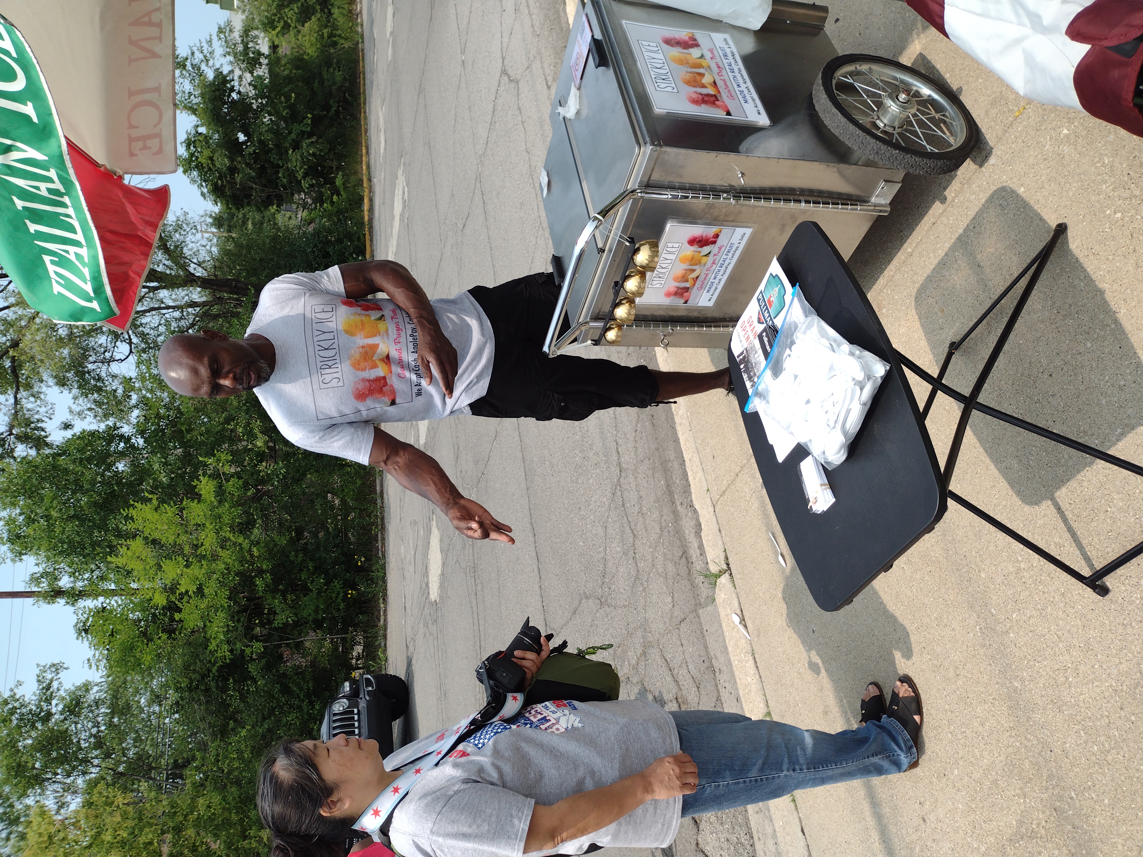 Emi Yamamoto getting some @strickly_ice, Community Festival 2021, 5th District Chicago Police Headquarters, July 17, 2021 (pic by Dr. John Kugler)