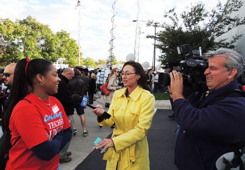 More than 20 TV trucks and more than 50 reporters waited impatiently outside the House of Delegates meeting until the vote was taken. Once the delegates began leaving, they were swarmed by reporters trying to get first responses after it was announced that the strike had been suspended. Substance photo by George N. Schmidt.