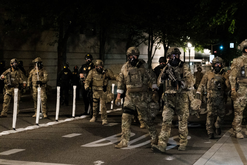 Federal officers prepare to disperse the crowd of protestors outside the Multnomah County Justice Center on July 17, 2020 in Portland, Oregon. Federal law enforcement agencies attempt to intervene as protests continue in Portland. (Photo by Mason Trinca/Getty Images)