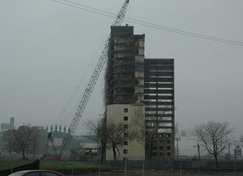 The demolition of the last buildings in the Stateway Gardens public housing projects along Chicago's State Street in April 2007 made it possible for those east of State to see U.S. Cellular Field, home of the Chicago White Sox, clearly for the first time. While the government was giving tax breaks to Sox owner Jerry Reinsdorf, it was refusing to continue to support public housing for poor black people. Substance photo, April 2007, by George N. Schmidt.