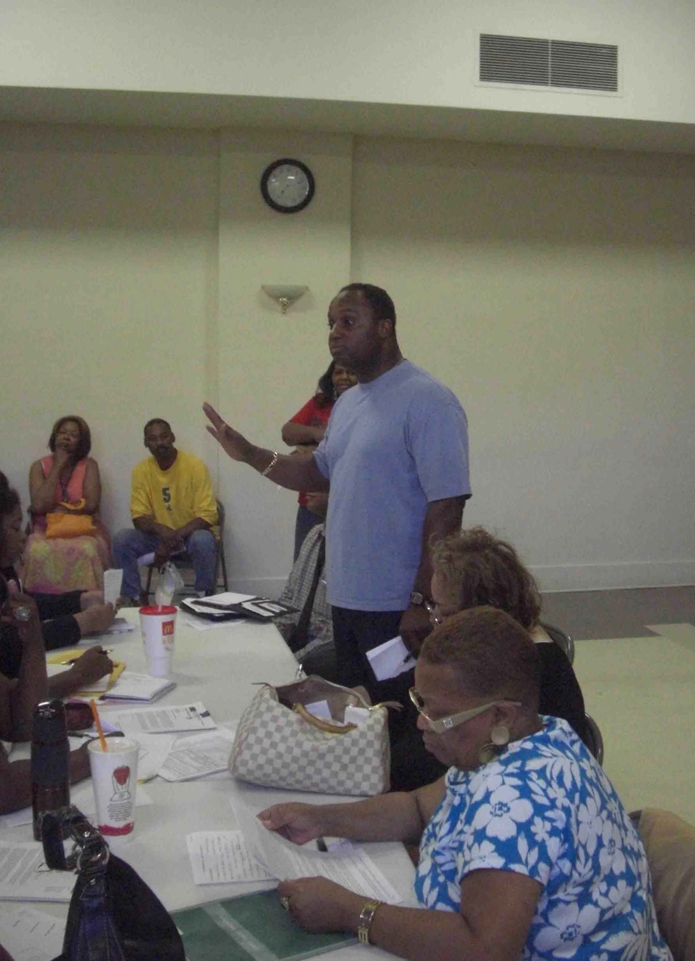 One of the hosts for the June 29 meeting at Operation PUSH was Jonathan Jackson (above, standing). Jonathan Jackson has been helping organize against school closings and turnarounds for the past two years, and has provided numerous kinds of support to teachers, students and parents from the schools that were under attack by the Daley administration. Substance photo by John Kugler.