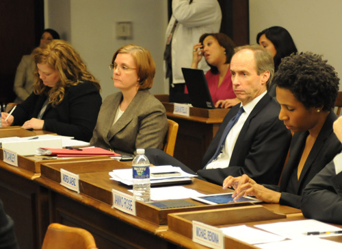 Only one of the people siting joyfully in the bureaucrats' seats during the December 14, 2011 meeting of the Chicago Board of Education was still cramming for her Ptydepe test, as the above photo shows. Right to left, 