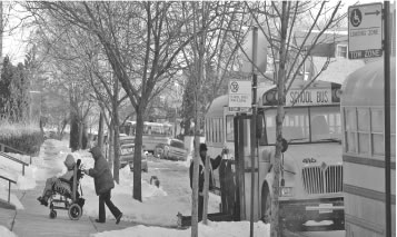 February 16, 2007, Christopher school, 5042 S. Artesian, Chicago. Bus aides and child welfare attendants wheel children into the special education school the day after CPS finally recognized the problem with the Alltown buses. (Substance photo by George N. Schmidt) 