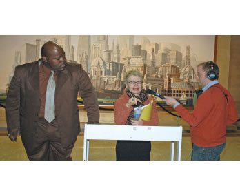 While WBEZ (right) interviews University of Illinois Professor Pauline Lipman (at podium), Jitu Brown of the Kenwood Oakland Community Organization (KOCO) looks on. KOCO and Dr. Lipman held a press conference at Chicago’s City Hall on January 31, 2007 to release the study, “Collateral Damage...” Dr. Lipman’s study of the impact of school closings in the mid-South area since 2002 challenged the Chicago Board of Education’s claims that the closings helped children. (Substance photo by George N. Schmidt). 