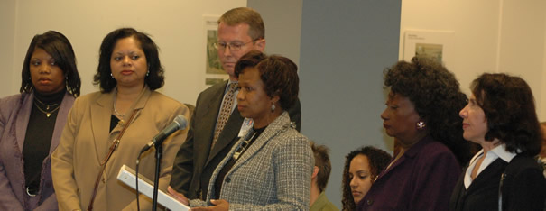 Speaking at the October 24 Board meeting, Air Force Lt. Col. Kim Harrell, (above holding papers) explained the proposal for the Air Force high school. Chicago Board of Education President Rufus Williams, who has claimed that the expansion of military high schools in Chicago is ensuring that students have “college preparatory” offerings, joked with Harrell that it was the first time he had seen her out of uniform. CPS officials have tried to downplay the militarization of Chicago’s high schools under the Daley administration’s Renaissance 2010 program. They have refused to discuss why military high schools and the nation’s largest JROTC (Junior Reserve Officer Training Corps) program is “college preparatory” for Chicago children — but not for children from Chicago’s wealthier suburbs. Substance photo by George N. Schmidt.