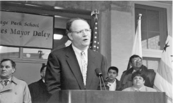 Above photo, Chicago 1999: Chicago Schools CEO Paul Vallas speaks at the dedication of the addition to the Portage Park Elementary School in Chicago, while Chicago Mayor Richard M. Daley looks on. Paul Vallas, one of the nation’s leading corporate “school reform” hacks, is now chief of the public schools of New Orleans. Vallas served as CEO of Chicago’s public schools from July 1995 through June 2001. While Vallas was pushing forward an agenda of privatization and union busting in Chicago, he managed to play a “divide and conquer” game against some of the unions by not attacking all at once. One of the reasons Vallas could be successful in Chicago was that the banks, for the first time in more than 15 years, allowed the Chicago Board of Education to borrow money for capital projects. After more than a decade of scandalous neglect, CPS saw a major building boom, although much of the money was lost to corruption and cronyism. While Vallas bought the loyalty of the building trades unions through projects such as the Portage Park addition, he was gutting the Service Employees International Union’s Local 46, which represented union custodial workers, through privatized outsourcing. All of the companies that received the private contracts cut wages and benefits by as much as 40 percent, ruining many families with children in Chicago’s public schools. Vallas and Daley were able to maintain the loyalty of the other unions — including the powerful Chicago Teachers Union — by attacking one group at a time. A similar ability to raise capital funds, blessed by the ruling class, is likely to give Vallas room to buy friends and punish enemies in New Orleans. Substance Archive photo by Sharon Schmidt.