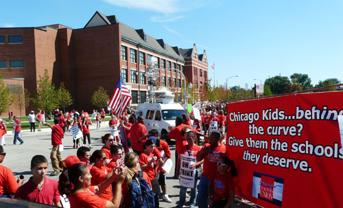 Strikers and supporters, including many students, begin to line up for the march through Chicago's West Side outside Marshall High School (background building) on September 13, 2012, the fourth day of the Chicago Teachers Strike of 2012. Substance photo by Kati Gilson.