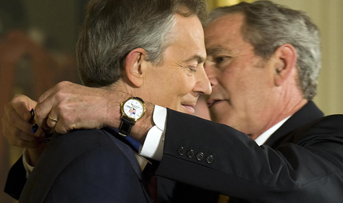 Tony Blair (left) and Geroge W. Bush were the two national leaders most responsible for the fraudulent 2003 invasion of Iraq. The subsequent endorsement of the Middle East wars by the Obama administration has come as no surprise to careful observers.