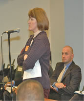 Despite the fact that the Board has a comprehensive “wellness” policy that is supposed to encourage physical activities at all grade levels, parent Amy Lux (above at micro- phone) returned to remind the Board that recess is still not being honored at the school her children attend and at many other Chicago elementary schools. (Substance photo by George N. Schmidt).
