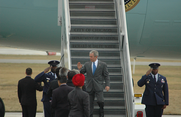President Bush waves from the tarmac.